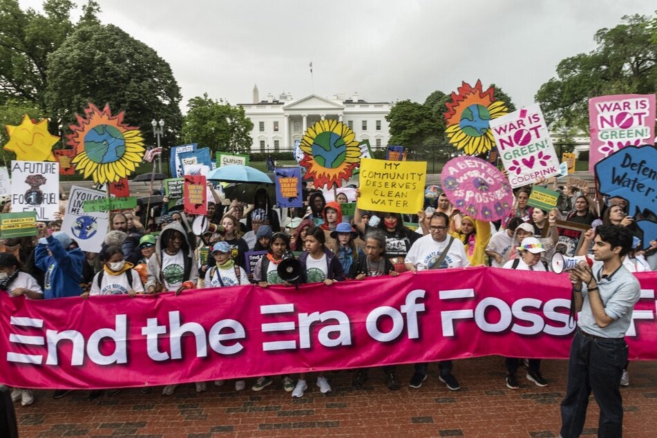 Environmental activists protest during an "End the Era of Fossil Fuels" rally in front of the White House in Washington DC.