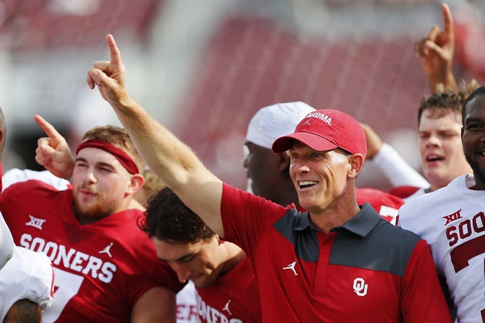 Head coach Brent Venables of the Oklahoma Sooners leads the team in the alma mater after their spring game at Gaylord Family Oklahoma Memorial Stadium.