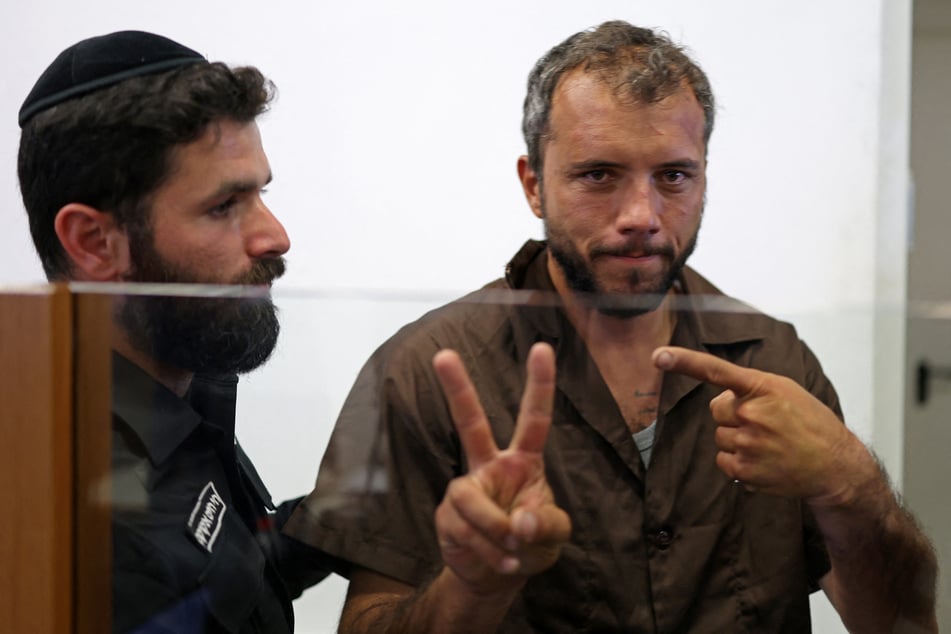 Brazilian activist Thiago Avila gestures upon his arrival at an Israeli court in Ashkelon on May 3, 2026.
