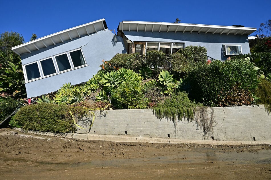 Photographs from the Pacific Palisades area showed one home – undamaged by the fire – that appeared to have broken in two after the flames were extinguished when part of a hillside collapsed.