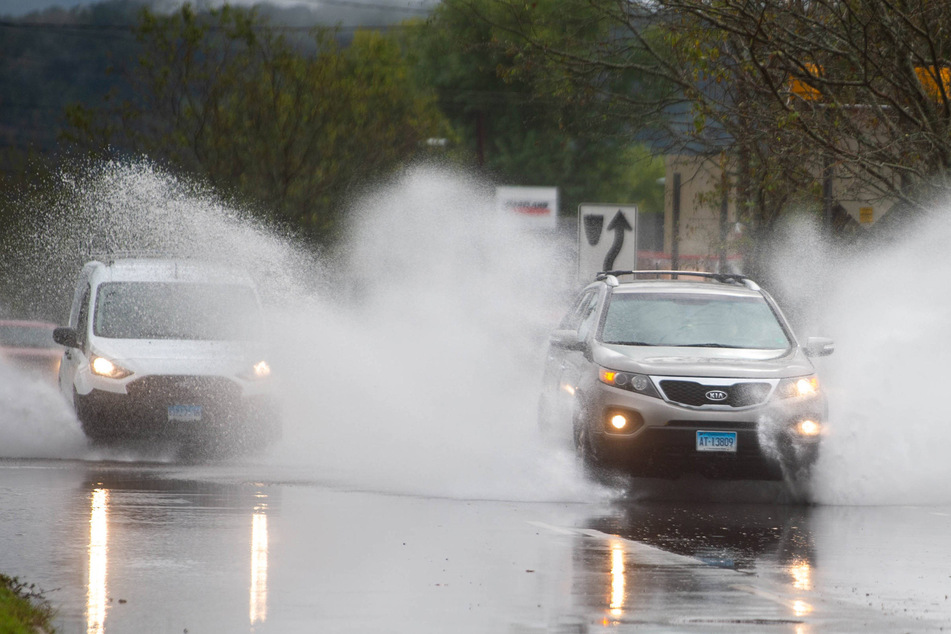 Two women died after they were swept away during "historic" flooding in the state of Connecticut, local officials said Monday.