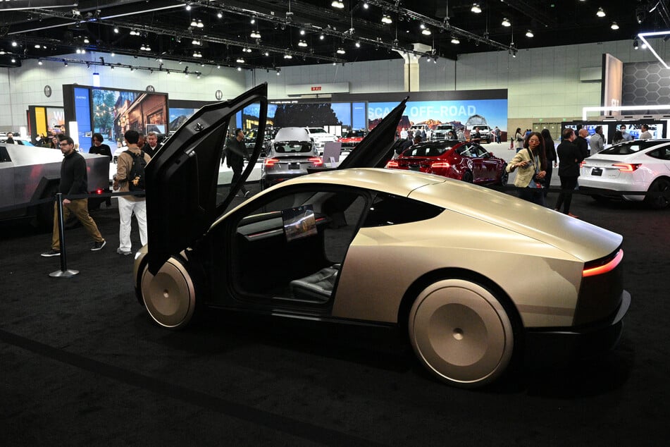 Tesla's Cybercab robotaxi is displayed during the AutoMobility LA 2024 auto show at the Los Angeles Convention Center in Los Angeles, November 21, 2024.