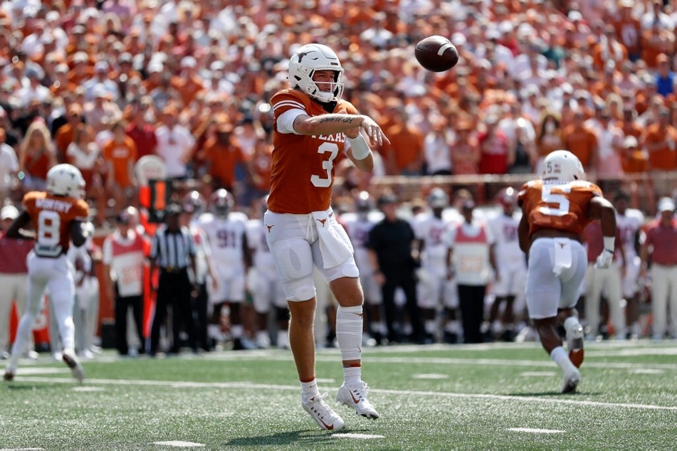 Quinn Ewers of the Texas Longhorns throws a pass in the first half of the game against the Alabama Crimson Tide.