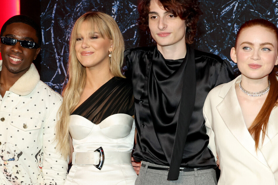 From l. to r.: Caleb McLaughlin, Millie Bobby Brown, Finn Wolfhard, and Sadie Sink attend the Stranger Things 4 premiere.