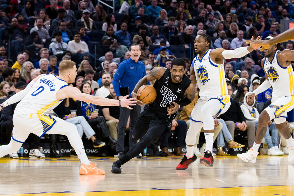Kyrie Irving (c.) finished with 38 points for the Brooklyn Nets in their comeback win over the Golden State Warriors.