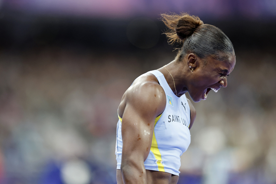 Julien Alfred of St. Lucia celebrates after winning gold in the women's 100m final.