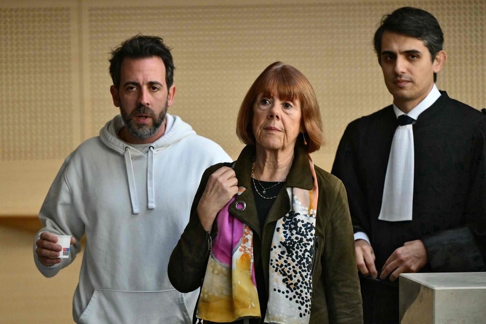 The French woman was also supported during the trial by her son Florian and her lawyer Stéphane Babonneau (right).