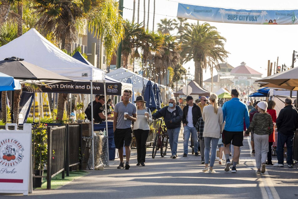 As Surf City Nights in Huntington Beach is already open for business, California's state representatives are discussing a full re-opening of its economy.