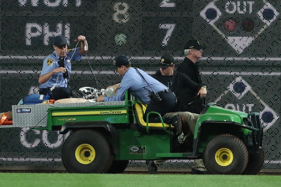 A Pittsburgh Pirates fan was hospitalized after falling from the bleachers onto the warning track on Wednesday.