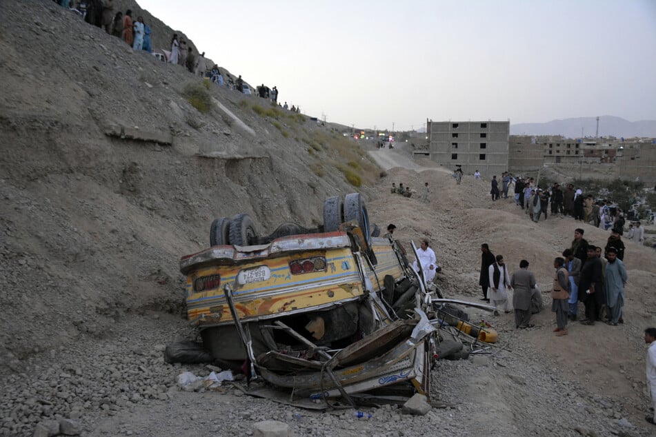 A bus carrying wedding guests plunged into a ravine in southwest Pakistan on Thursday, killing at least seven people.