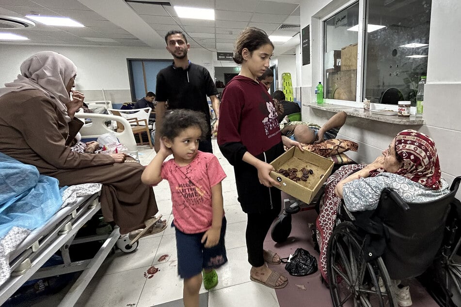Patients and internally displaced people are pictured at Al-Shifa hospital in Gaza City on November 10, 2023.