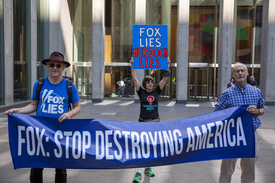 Protesters demonstrate outside of Fox News headquarters in New York, calling for indictments for the January 6 coup plotters and Donald Trump.