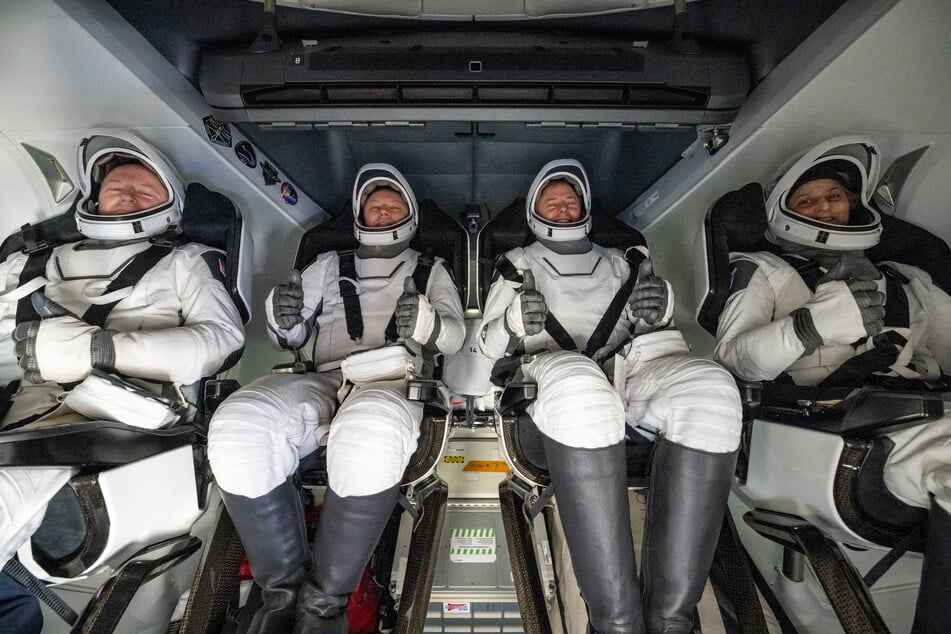 NASA astronauts Butch Wilmore, Nick Hague, and Suni Williams and Roscosmos cosmonaut Aleksandr Gorbunov are pictured inside a SpaceX Dragon spacecraft onboard the SpaceX recovery ship MEGAN shortly after landing in the water off the coast of Tallahassee, Florida, on March 18, 2025.