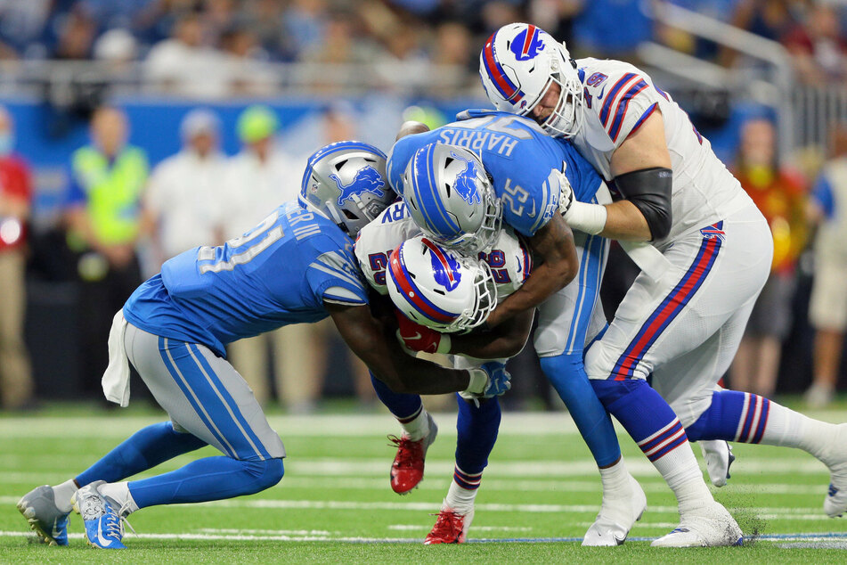 Buffalo Bills running back Devin Singletary was tackled by Detroit Lions defensive back Will Harris during the first half of the preseason football game on Friday night.