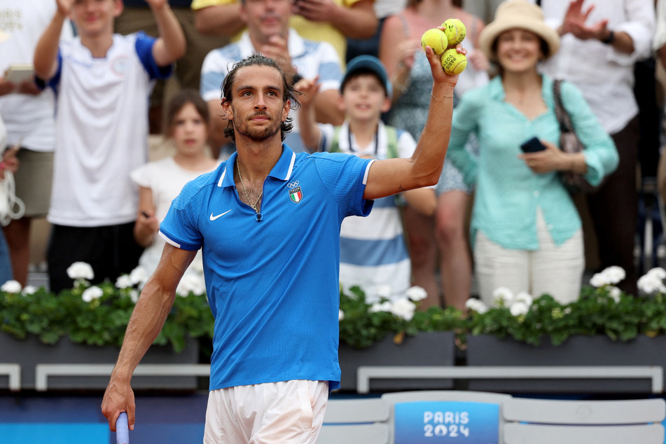 Lorenzo Musetti of Italy celebrates after winning his match against Alexander Zverev of Germany at the Paris Olympics, teeing up a semi-final showdown with Novak Djokovic of Serbia.