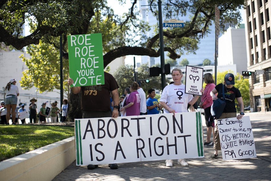 Demonstrators march for abortion rights outside of the Harris County Courthouse in Houston, Texas.