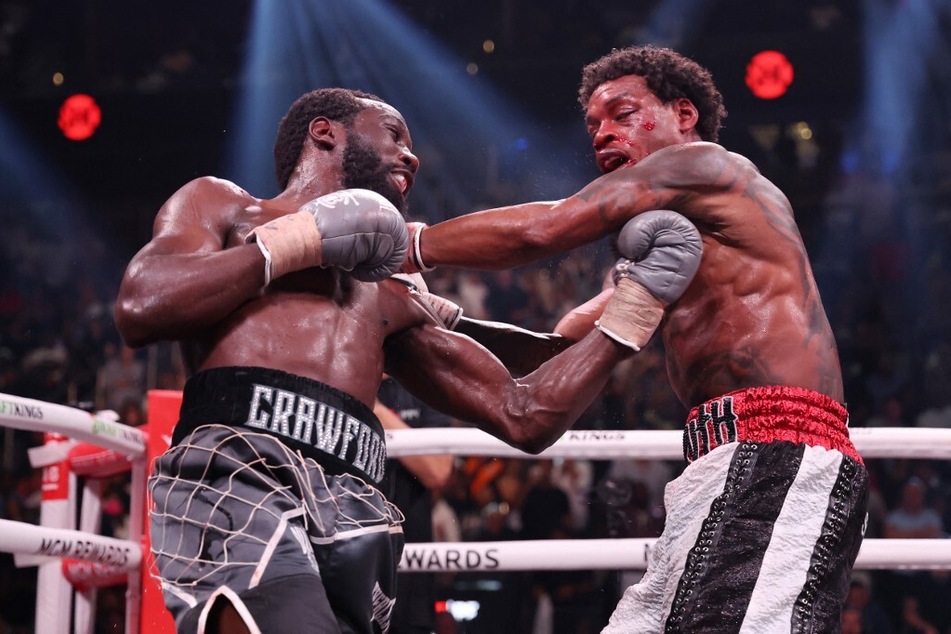 Terence Crawford and Errol Spence Jr. exchange punches during round nine of the World Welterweight Championship bout at T-Mobile Arena on July 29, 2023 in Las Vegas, Nevada.