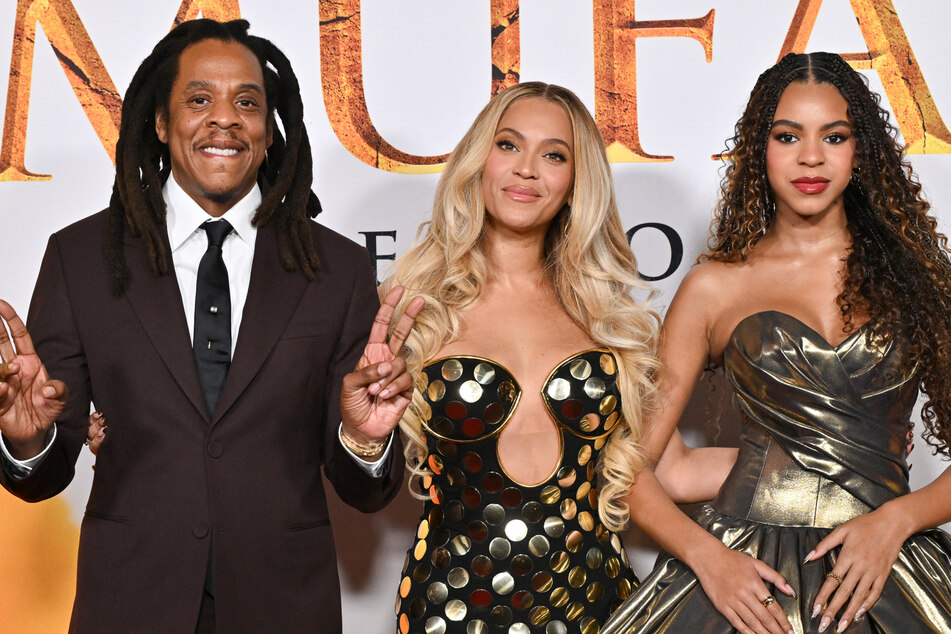 Jay-Z (l.) joined his wife, Beyoncé, and daughter, Blue Ivy (r.), on the red carpet at the premiere of Disney's Mufasa on the heels of explosive allegations against the rap mogul.