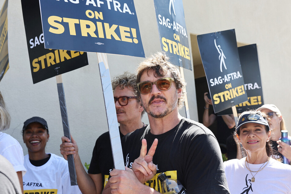 SAG-AFTRA members like Pedro Pascal (c.) continued to picket on Tuesday.
