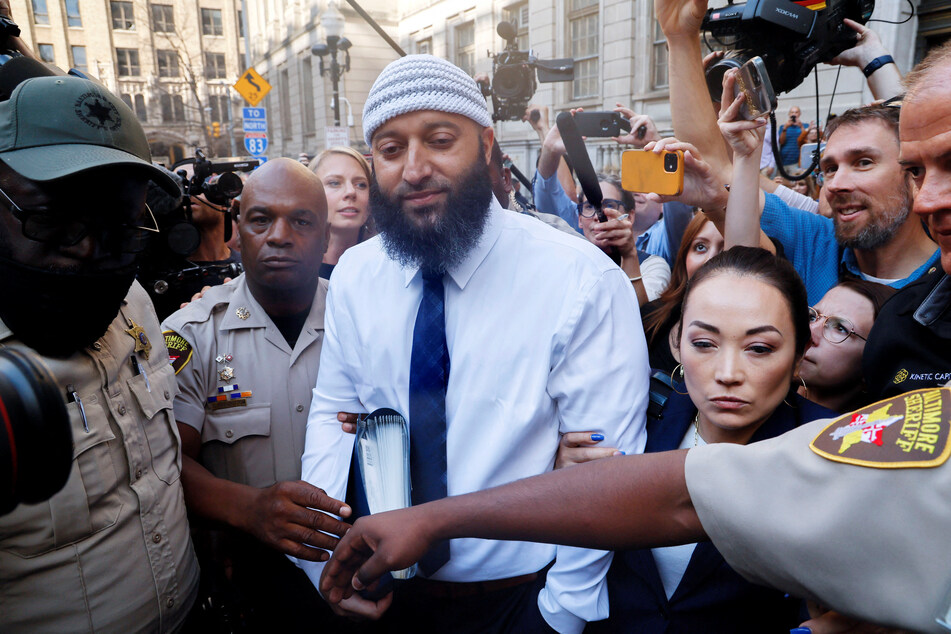 Adnan Syed, whose case was chronicled in the hit podcast Serial, leaves the courthouse with his attorney Erica Suter.