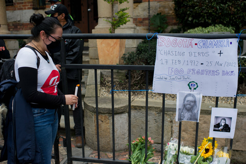 Mourning fans leave flowers and tributes to Taylor Hawkins at the Four Seasons Hotel in Bogota where he died.