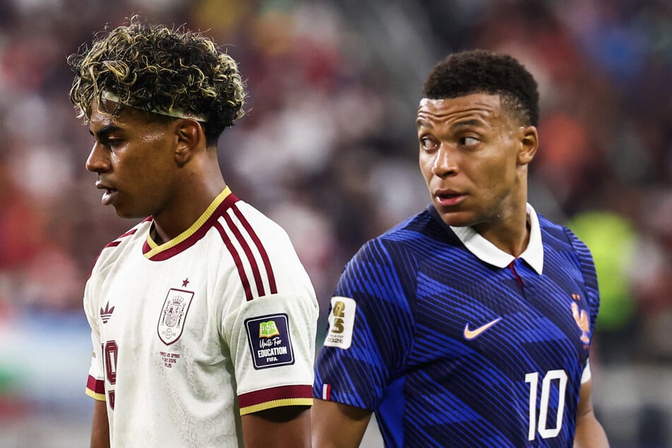 French forward Kylian Mbappe (r) reacts past Spain forward Lamine Yamal (l) during the World Cup semifinal match on Tuesday.
