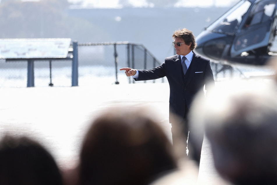 Tom Cruise landed a helicopter on the USS Midway Museum ahead of the Top Gun: Maverick premiere.