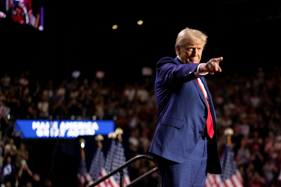 Then Republican presidential nominee, now president-elect, Donald Trump attends a campaign rally at Mullett Arena in Tempe, Arizona, on October 24, 2024.