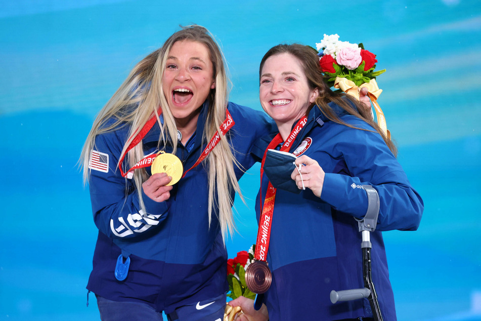 Oksana Masters (l) and Kendall Gretsch (r) are all smiles during the medal ceremony for the Women’s Sprint (Sitting) Biathlon Final.