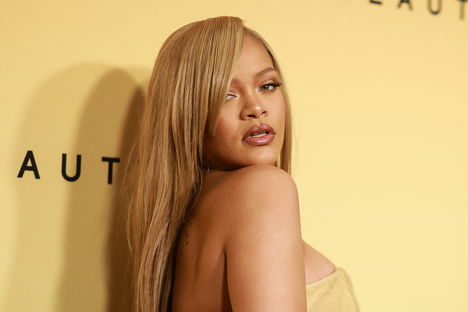 Rihanna has given coy insight into her Met Gala look plus her "amazing" new music.