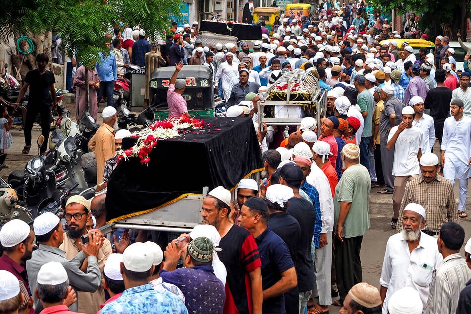 Mourners carry the coffins of victims who died in the Air India Flight 171 crash, for funeral ceremony in Ahmedabad on Saturday.