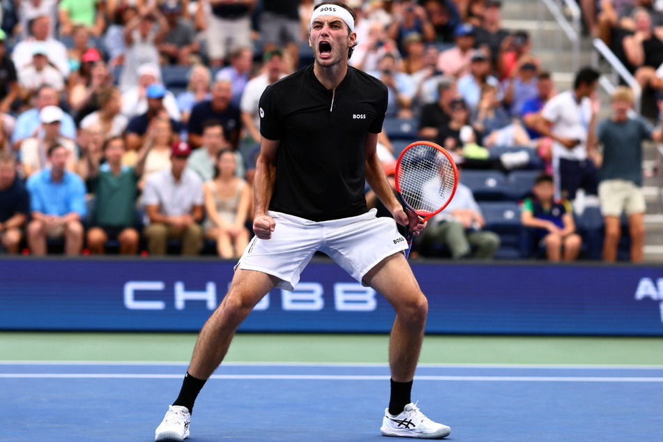 Taylor Fritz celebrates winning his round of 16 match against Casper Ruud at the 2024 US Open.