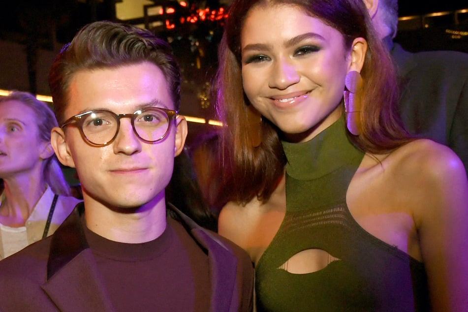 Zendaya (r.) and Tom Holland, who made their romance official in 2021, have yet to confirm whether they secretly got married.