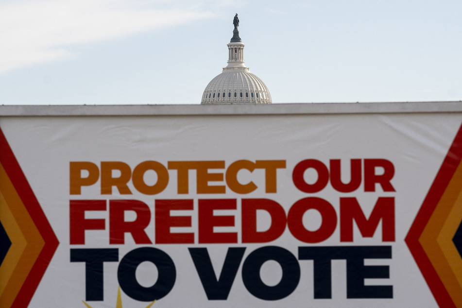 A vehicle displays a sign reading “Protect Our Freedom To Vote” in front of the US Capitol in Washington, DC, on January 19, 2022.