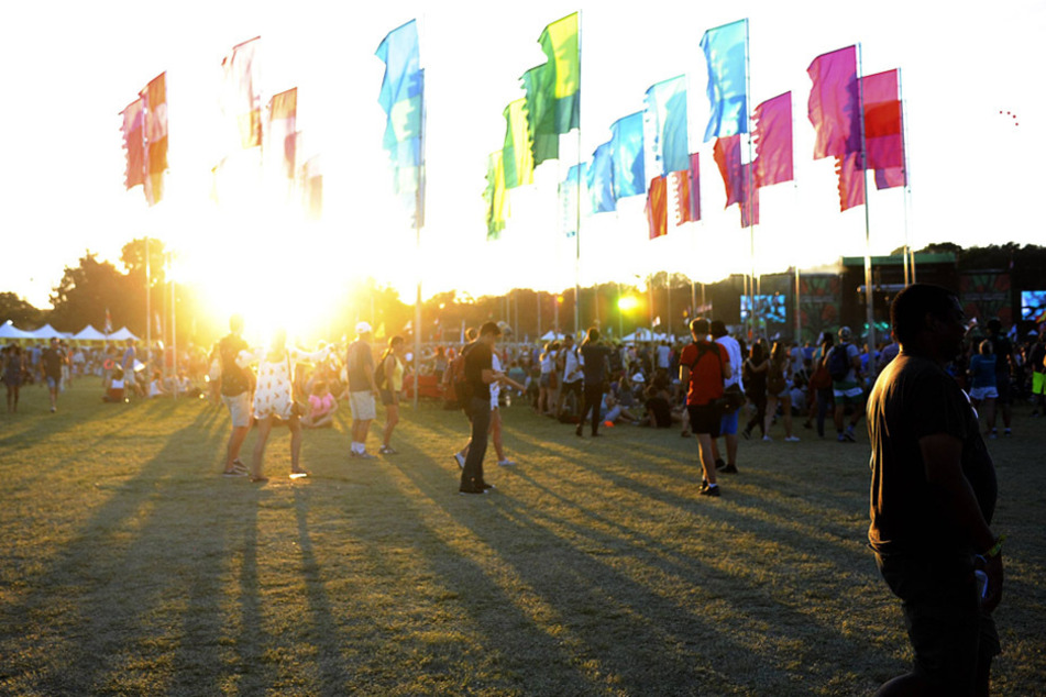 Festival goers gathered around flags at the Austin City Limits Music Festival in Austin, Texas in October 2015.