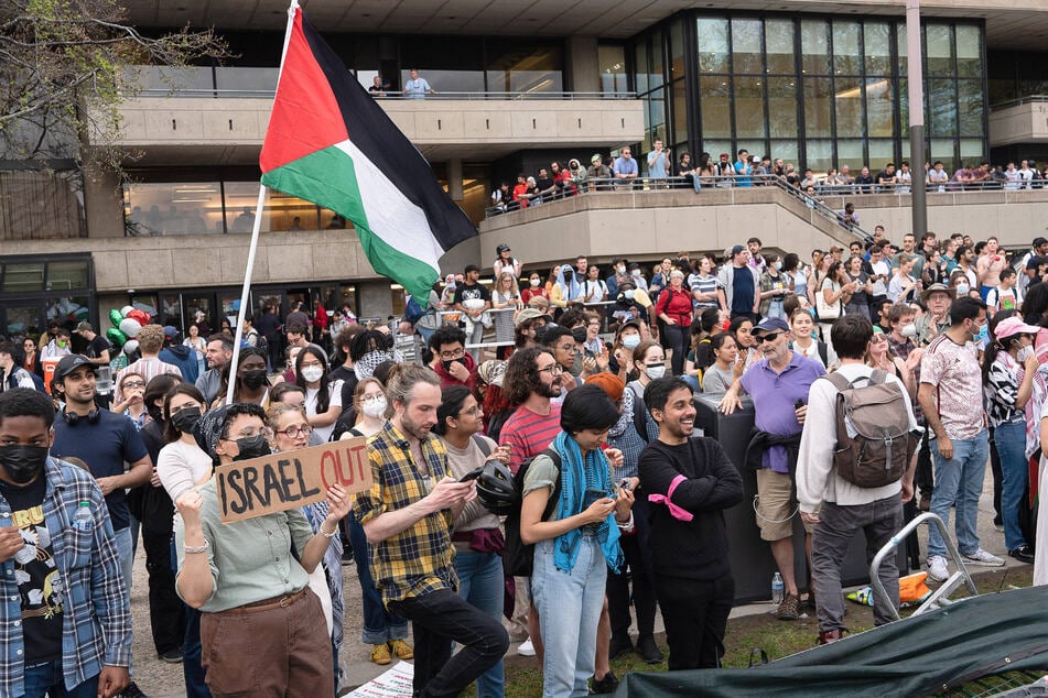 Members of the MIT campus community attend a rally calling on the university to divest from Israel.