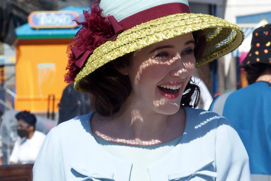 Rachel Brosnahan, as Mrs. Maisel, while filming The Marvelous Mrs. Maisel at Coney Island Amusement park