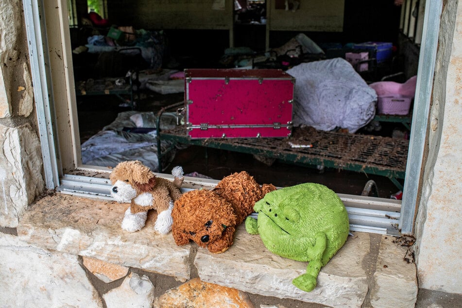 Stuffed animals sit in a windowsill at Camp Mystic after a deadly flooding in Kerr County, Texas, on July 5, 2025.