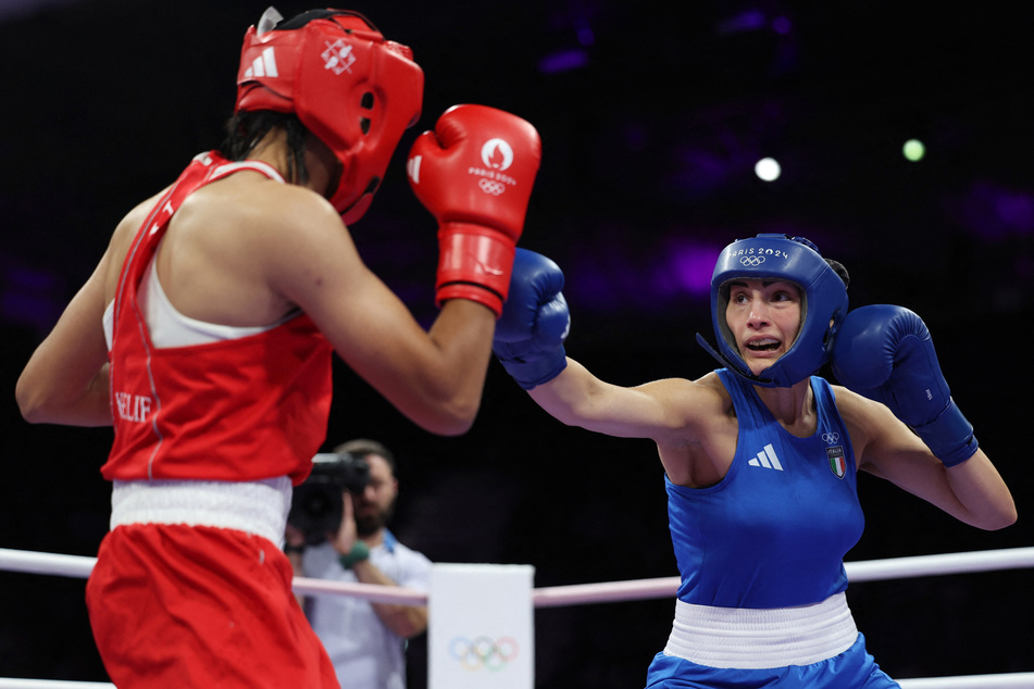 Angela Carini of Italy (r.) in action against Imane Khelif of Algeria at the Paris Olympics.