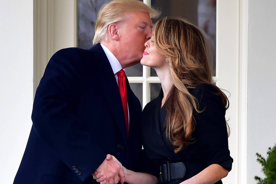 Donald Trump kissing Communications Director Hope Hicks at the White House on March 29, 2018.