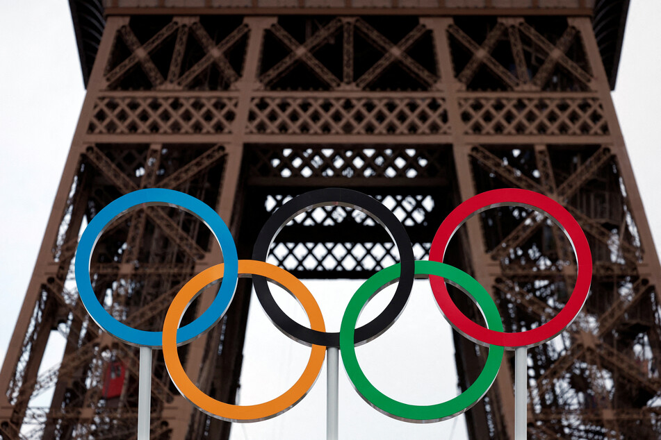 The Olympic rings are displayed on the Eiffel Tower in Paris, France.