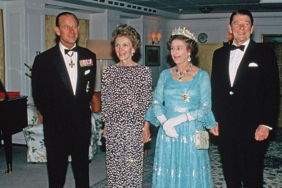 A newly released cache of FBI files has revealed a potential plot to assassinate Queen Elizabeth II (2nd from r.) during a royal visit to California in 1983.