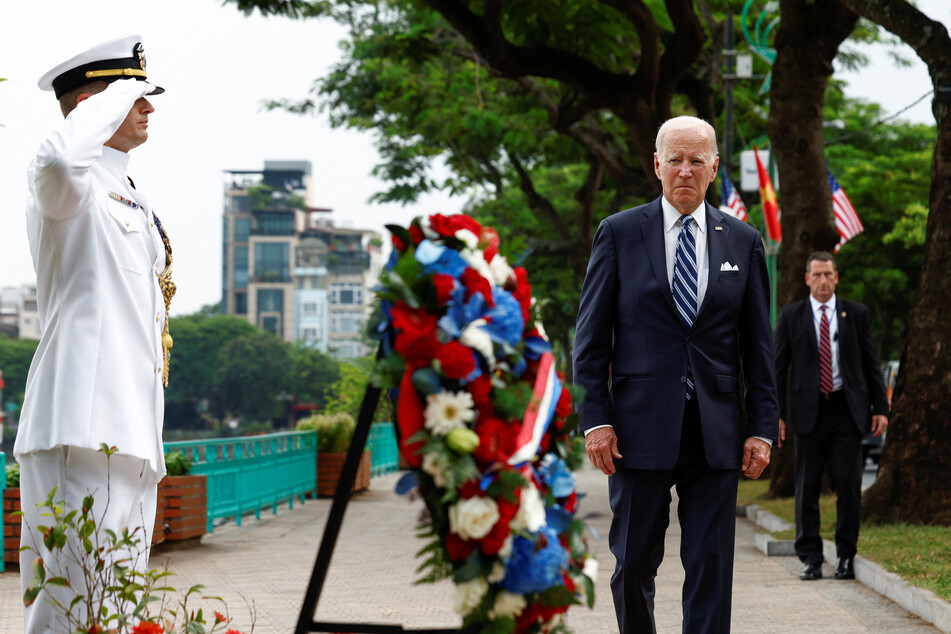 President Joe Biden visits a memorial to the late US Senator John McCain in Hanoi on September 11, 2023.