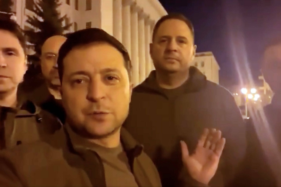 Ukrainian President Volodymyr Zelensky, surrounded by several top officials, addressed the country Friday nigh from the doorstep of the presidential administration in central Kyiv to show he and other leaders haven t fled the capital.