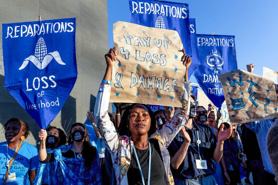 Activists demand loss and damage reparations during the COP27 UN Climate Change Conference in Sharm el-Sheikh, Egypt.