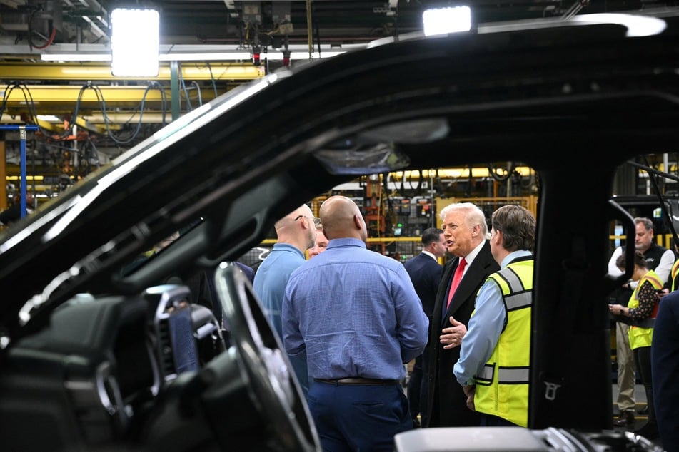 The Ford factory worker who heckled President Donald Trump in January has been reinstated with no permanent mark on his record.
