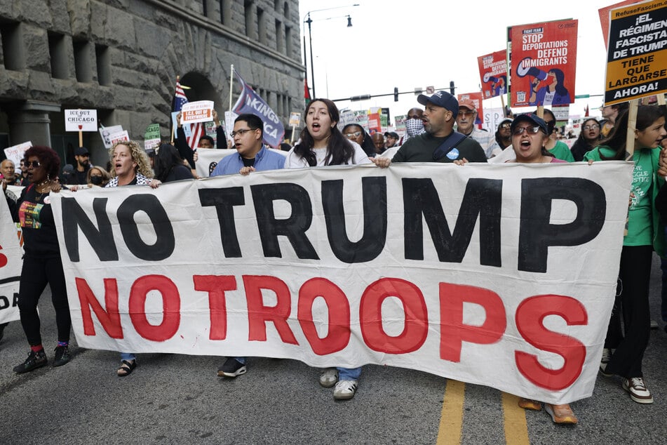 People participate in a demonstration against the planned deployment of National Guard troops in Chicago on September 6, 2025.