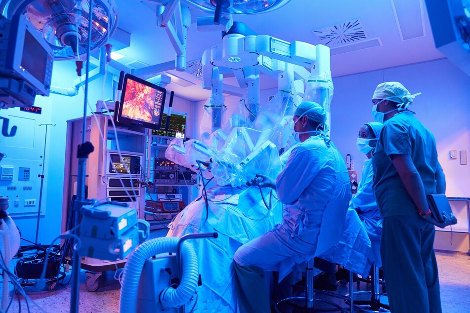 Surgeons conduct a procedure using a da Vinci surgical robot from Intuitive Surgical.