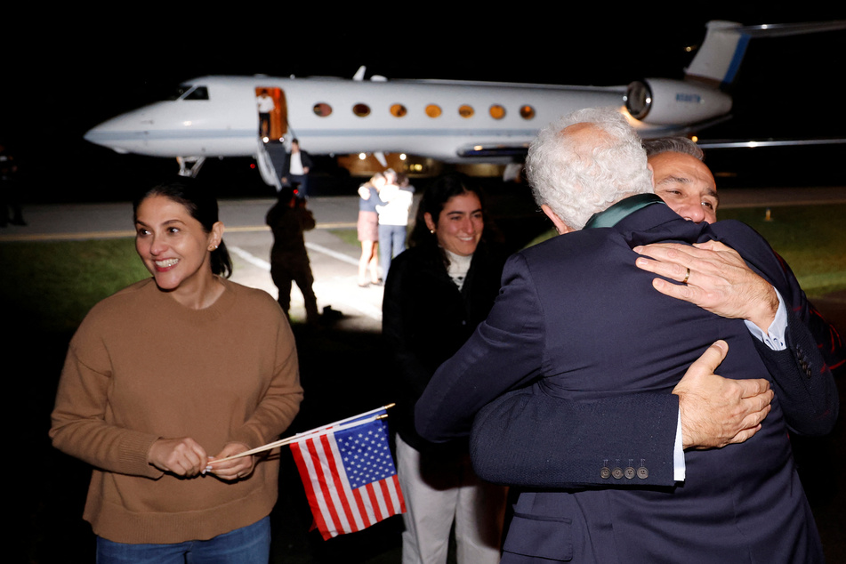 Familu members of freed Iranian-Americans – among them Siamak Namazi, Morad Tahbaz, and Emad Sharg –celebrate their return to the US after a prisoner swap with Iran.