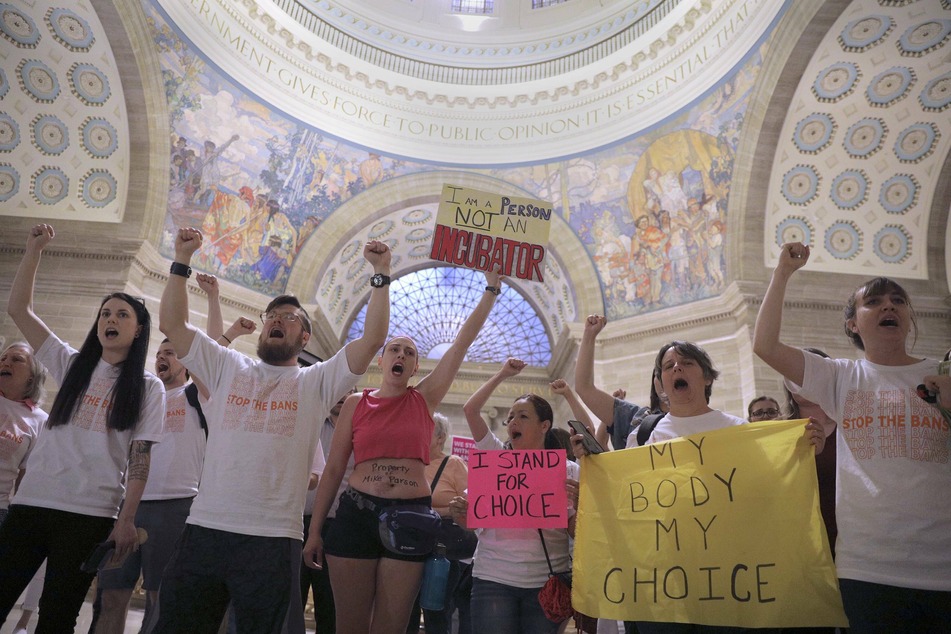 Reproductive rights advocates in Jefferson City rally against GOP efforts to restrict abortion access in the state.